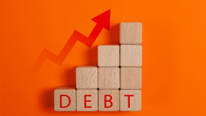 Does Chapter 11 forgive debt — wooden blocks spelling DEBT with rising arrow graph on orange background