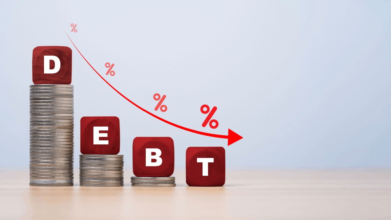Red wooden blocks spelling DEBT on descending coin stacks showing what debts cannot be discharged in bankruptcy versus dischargeable obligations
